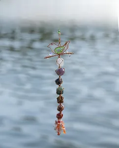 Handmade chakra crystal bird hanger with seven natural stones and tassel detail