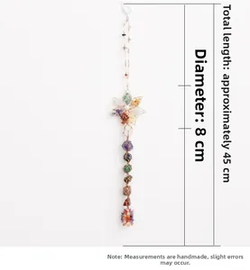 Close-up of handmade 7 chakra natural stone dream catcher with lotus and hexagram details