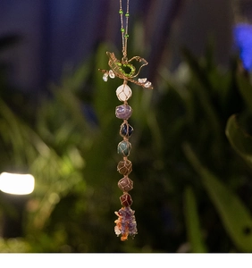 Chakra wall hanging with hand-woven metal bird and seven natural raw stones