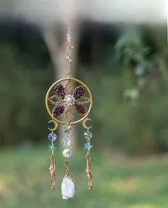 Bohemian gold suncatcher featuring crystal dreamcatcher design with moon and star accents