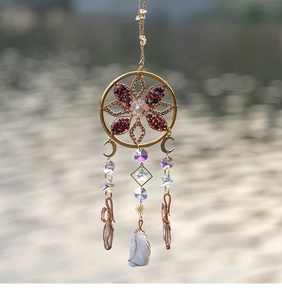 Handcrafted gold wire-wrapped dream catcher with white crystal cluster and metal moon
