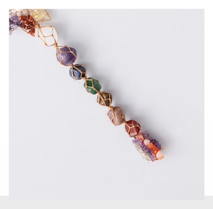 Macro view of hand-woven natural crystal stones in hemp pouches for healing decor