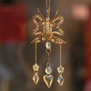 Handmade butterfly suncatcher with golden wire, heart crystal, and hanging prisms