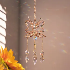 Handmade wire butterfly suncatcher with purple crystal beads and rainbow prism pendants