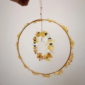 Hanging golden suncatcher with citrine crystals and a faceted prism ball for garden decor