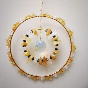 Hanging golden suncatcher with citrine stones and a faceted crystal ball for garden decor
