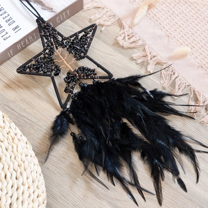 Star-shaped Bohemian dream catcher with tree of life design and black feathers
