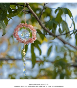 Detailed suncatcher featuring pink stone ring, crystal ball, and golden dragonfly charm