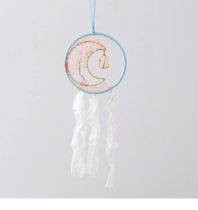 Detailed view of Tree of Life suncatcher with pink crystals and moon wire weaving