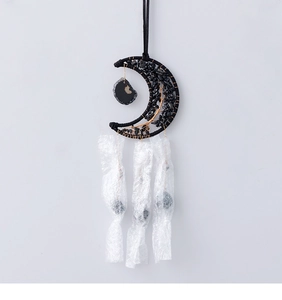 Detailed view of Tree of Life design on black moon suncatcher with metallic wire wrapping