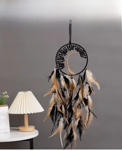 Detail of bohemian Tree of Life dream catcher with black feathers and natural stones