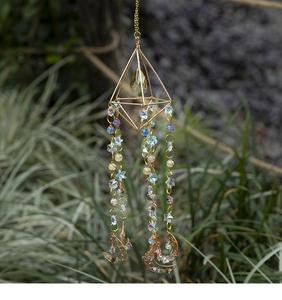 Detail of bohemian gold geometric crystal suncatcher with moon pendant and colorful beads