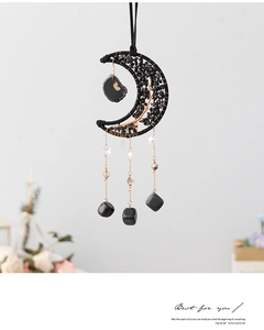 Detail of Tree of Life design with black crystal stones on moon suncatcher ornament