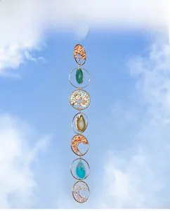 Detail of multi-layer Tree of Life wind chime with colorful crystals and agate drops