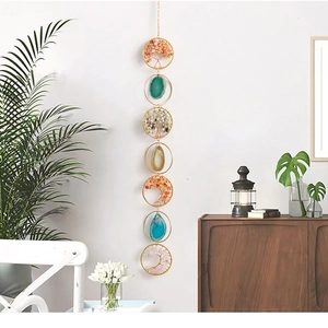 Detail of Tree of Life wall hanging with colorful crystal stones and agate slices