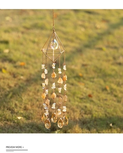 Macro detail of suncatcher featuring golden frame and natural citrine stones