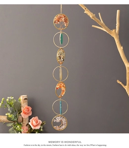 Detail of tree of life wall hanging with natural agate slices and crystal stones