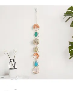 Macro view of multi-colored crystal tree of life hanging decor with agate slices