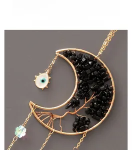Detail of moon suncatcher with tree of life stones, evil eye and crystal beads