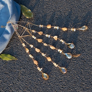 Bohemian gold suncatcher with raw citrine stones and amber crystal teardrop pendants