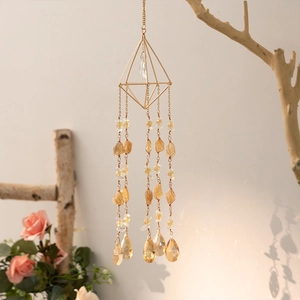 Handmade citrine suncatcher featuring a golden geometric frame and faceted crystal droplets