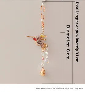 Detail of beaded hummingbird suncatcher with dimensions 31cm length and 8cm width