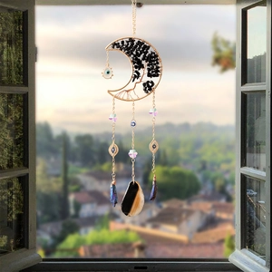 Celestial suncatcher with golden crescent moon, tree of life, and colorful crystals