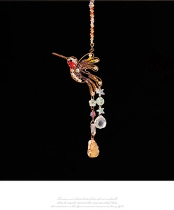 Detailed hummingbird suncatcher with colorful crystals and handmade wire wrap metal