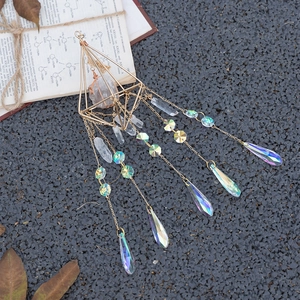 Geometric gold suncatcher with raw crystal and rainbow prism pendant for garden decor