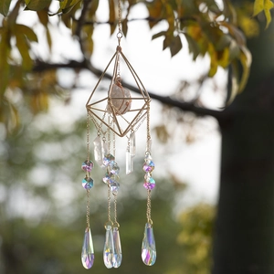 Crystal suncatcher with geometric brass frame and rainbow prism pendants for garden decor