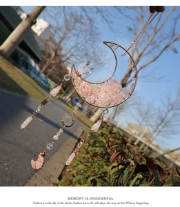 Detailed pink crystal moon suncatcher with metallic wire wrap and prism pendants