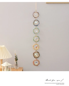 Detailed view of handmade seven chakra dreamcatcher with natural stones and crystals