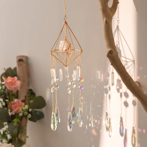 Crystal suncatcher with golden geometric frame and rainbow prism pendants for garden decor