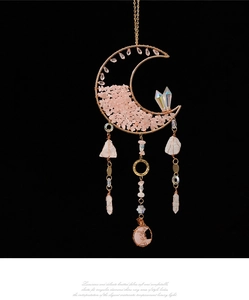 Detail of moon suncatcher featuring pink quartz stones and crystal quartz drops