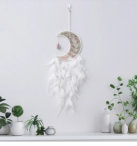 Detail of white moon dreamcatcher with tree of life crystal stones and soft feathers