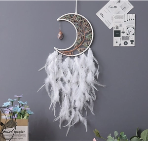 Detail of moon dreamcatcher with white feathers, crystal tree of life, and boho beads