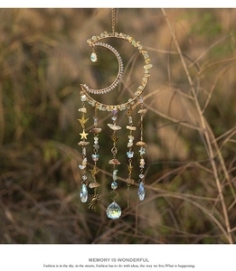 Detailed sun catcher featuring crescent moon with raw crystals and celestial metal charms