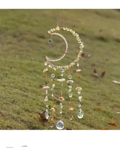 Moon dreamcatcher with raw yellow gemstones, evil eye bead and crystal pendants