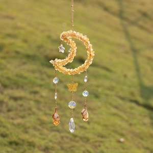 Bohemian suncatcher with crescent citrine moon, golden butterfly, and faceted crystal beads