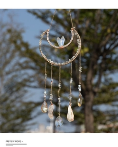 Detailed bohemian crescent moon suncatcher with raw crystal pillars and labradorite stones