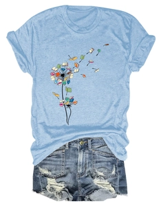Flat lay of blue T-shirt with book dandelion print and distressed denim shorts