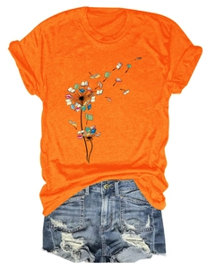Detail of orange cotton T-shirt featuring dandelion book graphic and distressed denim shorts