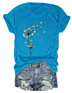 Detailed flat lay of bright blue dandelion book print T-shirt with denim shorts