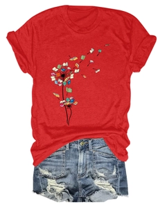 Detail of red crew neck t-shirt featuring creative dandelion book print and ripped denim shorts