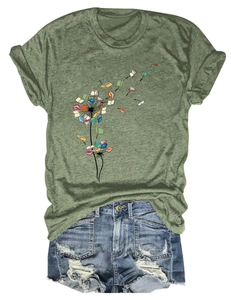 Detail of dandelion book print on dark green short sleeve T-shirt with denim shorts