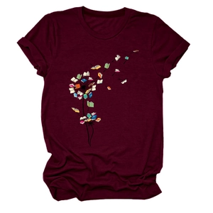 Detail of creative dandelion book print on a burgundy cotton crew neck short sleeve T-shirt