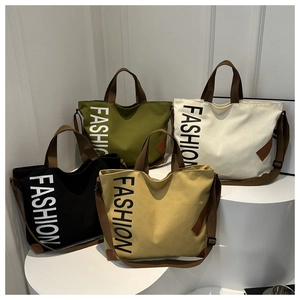 Contrast stitching canvas tote bags in four colors with adjustable brown straps and lettering
