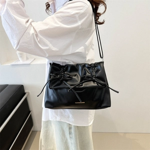 Chic black pleated tote bag with bow accents and gold fashion lettering for women