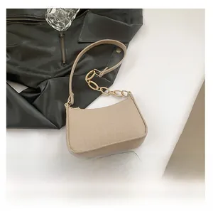 Beige crocodile texture crossbody bag detail with gold metal chain and size reference