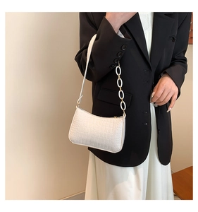 Chic white crocodile pattern underarm bag featuring a trendy white resin chain strap